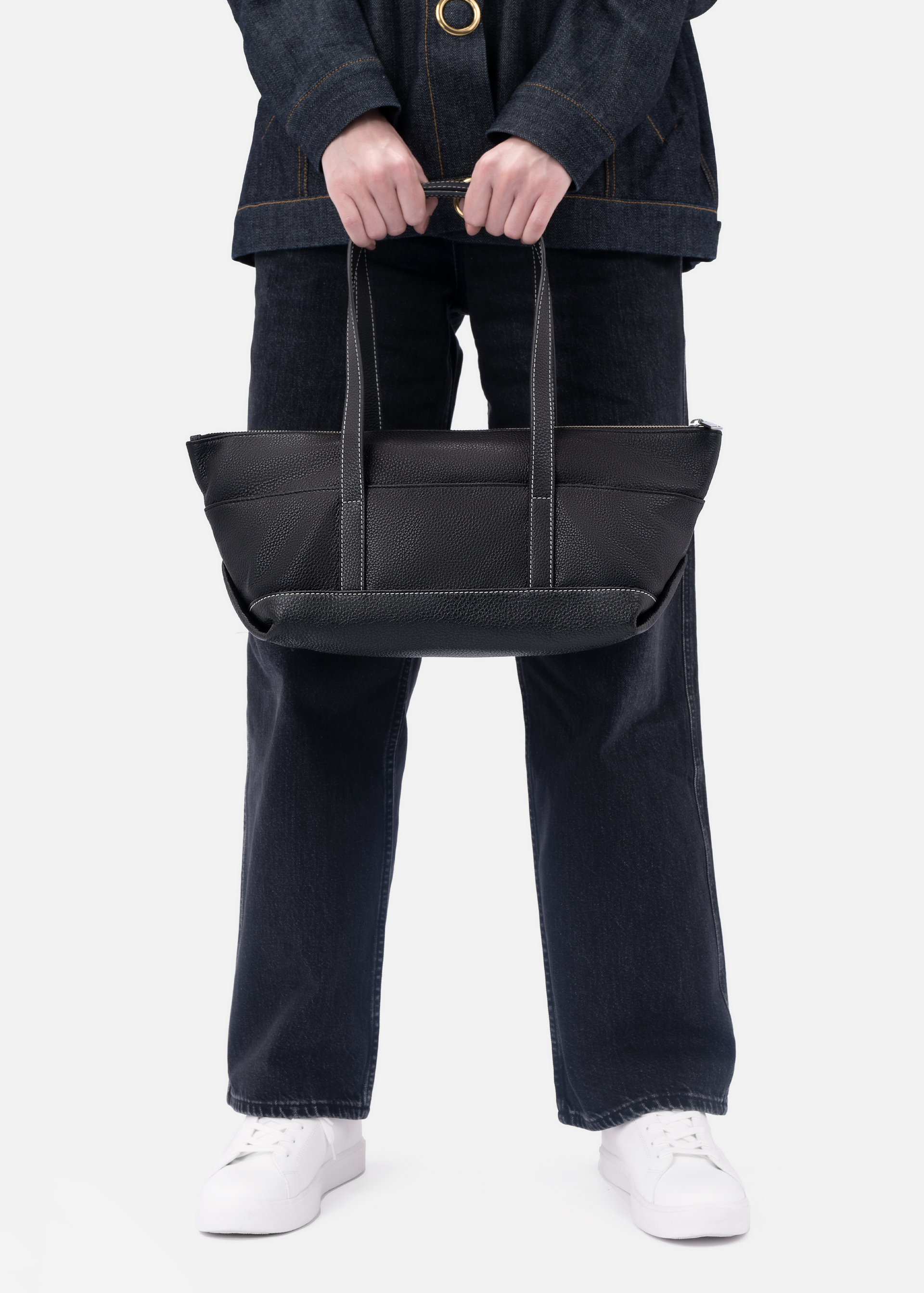 Maria pebble leather shoulder bag in black with white stitching