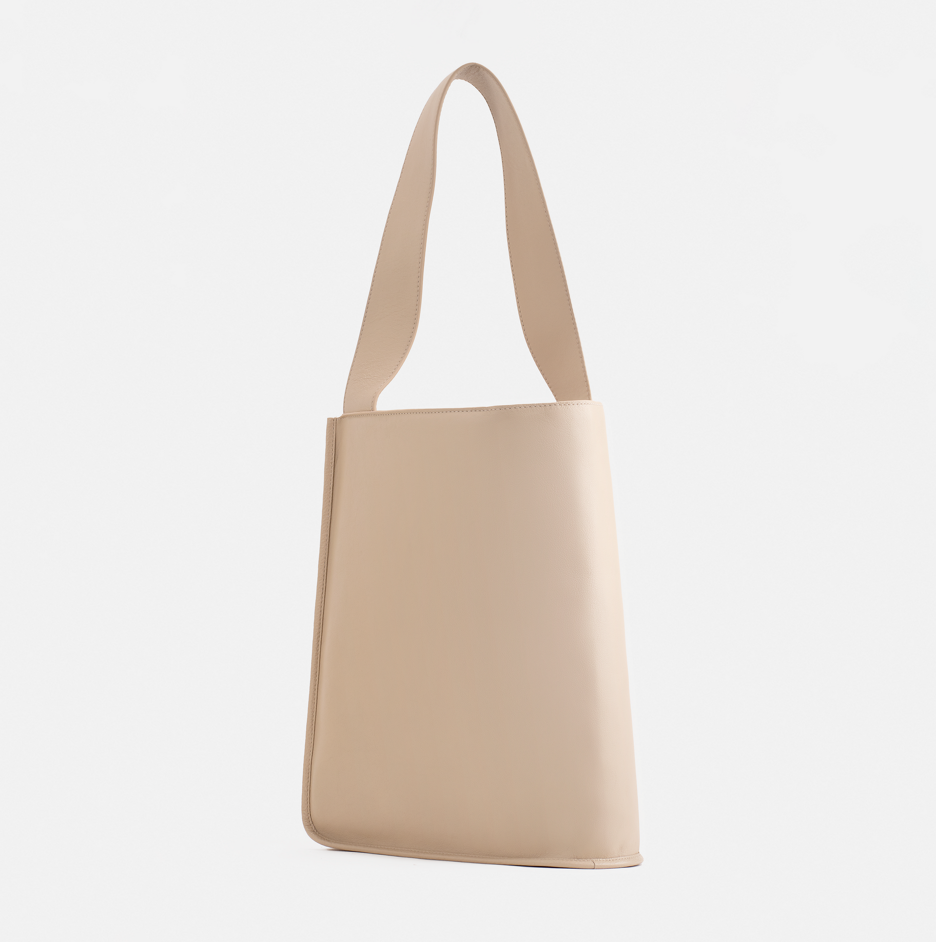 Eileen wraparound pebble leather shoulder bag in ivory