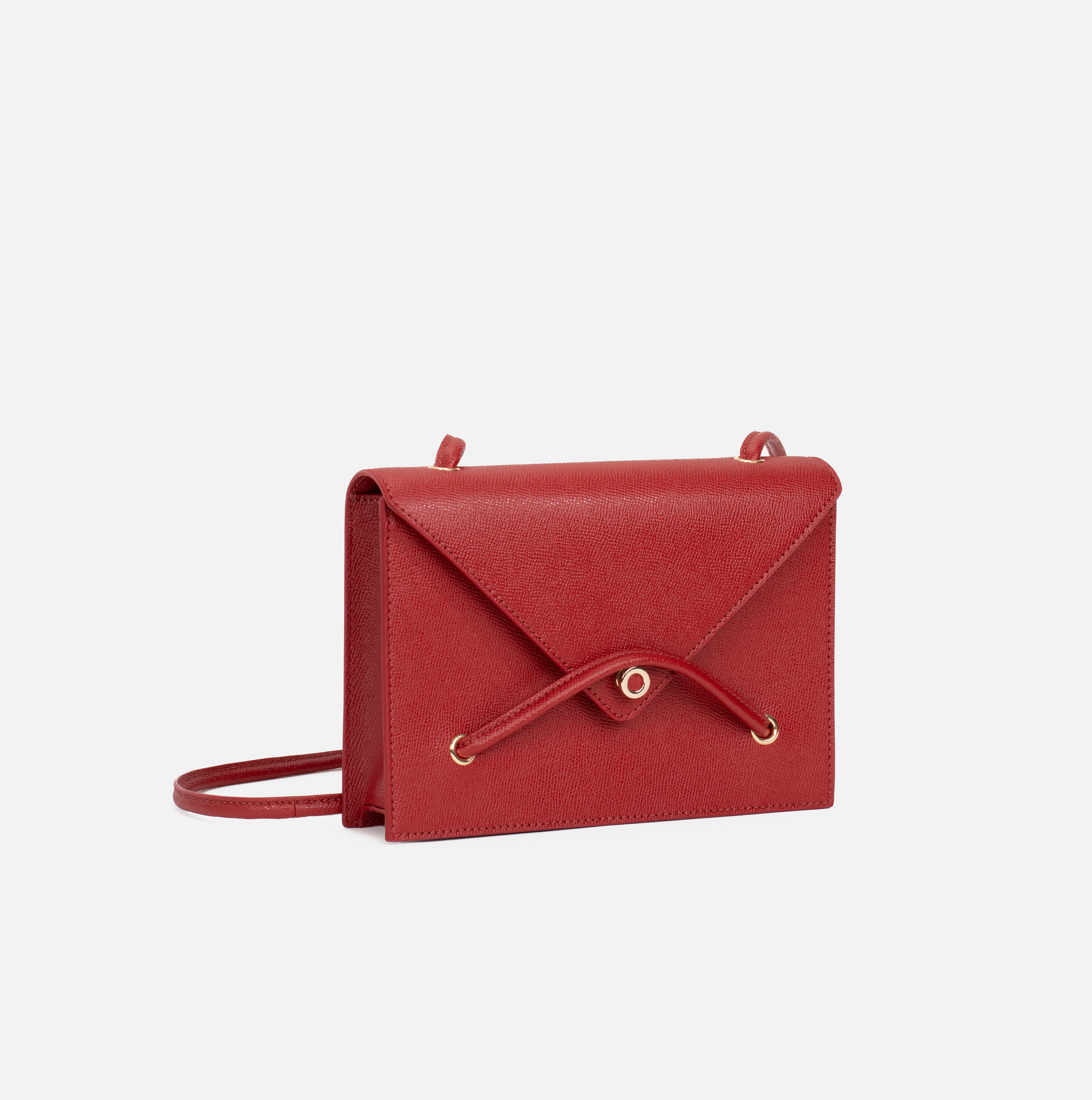 Lella cross grain embossed leather crossbody bag in ruby