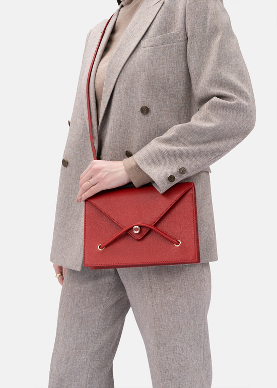 Lella cross grain embossed leather crossbody bag in ruby