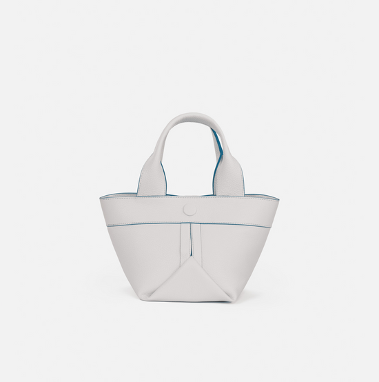Gusset small pebble leather tote in white with cobalt blue edge paint