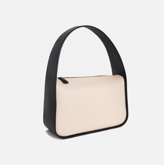 Grete pebble leather shoulder bag in bare / black with black edge paint